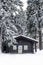Log Cabin in the Woods in Winter