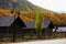 Log home resort with cheerful colorful alpine background at Hemu village, Xinjiang, China