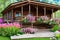 A Log House Porch in Spring: The Perfect Spot to Enjoy the Season\\\'s Flowers with Generative AI