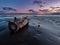 A log on a shallow beach.