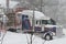 Log truck in blizzard