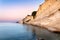 Logas sunset beach with sheer white cliffs in Peroulades village on Corfu Island in Greece. Loggas is famous for scenic