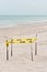 Loggerhead turtle nest, corded off by yellow tape, at a tropical sandy beach