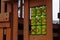 Logic game, tic-tac-toe, kind of three-in-a-row game is red and orange symbols applied to green cylinders on children playground