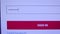 Login web page closeup. Entering password and clicking the button sign in on computer screen