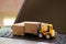 Logistic and cargo freight concept: Fork-lift a truck moves a paper box on notebook keyboard. depicts International freight or