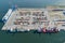 Logistic port, cargo ships and containers, military equipment. Drone view