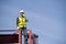 Logistics engineer stand and Pointing up around Shipping container stacker in commercial transport port