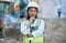 Logistics security, construction worker and woman thinking with arms crossed on building site, doing inspection and