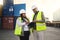 Logistics, tablet and black woman and man in container shipping yard checking online inventory list. Industrial cargo