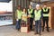 Logistics team with sack truck in a warehouse