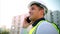 Logistics worker talking on phone call, in communication about construction of building and planning renovation of