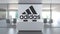 Logo of ADIDAS on a wall in the modern office, editorial conceptual 3D animation