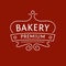 Logo for the bakery on red-brown background. The