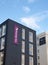 Logo and banner sign on the corner of a premier inn hotel and No 1 whitehall place office development on whitehall road in leeds