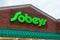 The logo and brand sign on Canadian retail business Sobeys grocery store