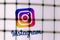 The logo of the social network Instagram behind bars. The concept of Instagram censorship and prohibition