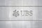 Logo of a Swiss bank UBS sculpted on the stone wall of building close up in city center of Zurich,.