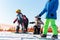 Logoisk. Belarus. 01.05. 2023. A group of snowboarding children descend the slope.