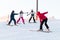 Logoisk. Belarus. 01.05. 2023. A group of snowboarding children descend the slope.