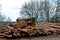 Logs stacked on logging and woodworking industry. A stock pile of timber, chopped down trees. Timber industry. De-forestation