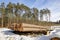 Logs of wood covered with a thick layer of snow. Deforestation in Central Europe