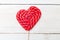 Lollipop on a heart shaped stick on a wooden background. Valenti