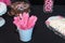 Lollipop rock sugar crystal pink candy sweets stick white bucket table