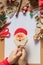 Lollipop Santa Claus in child`s hand. Concept of New year and Christmas