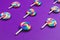 Lollipops are arranged symmetrically on a colored background. colorful candies