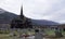 Lom Stavkirke stave church and graveyard in autumn in Norway