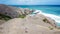 Lombok - Girl in white dress walking on the cliffs