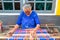 LOMBOK, INDONESIA - DECEMBER 30, 2016: Woman weaving on a loom i