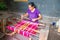 LOMBOK, INDONESIA - DECEMBER 30, 2016: Woman weaving on a loom in Indonesia