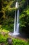 Lombok, Tiu Kelep waterfall in Senaru, Lombok, Indonesia. Tourists from overseas were enjoying the waterfall.