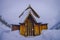 Lomen, Norway - March 26, 2018: Beautiful outdoor view of stave Church of Lomen, covered with snow during winter at