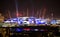 London arena under light performing. City lights background.