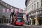 London bus under the flags