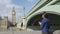 London business woman on phone using app on smartphone by Westminster Bridge