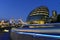 London city hall building next to the Tower Bridge at night