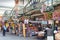 London, England - 30 August 2016: Pedestrians look at different stalls at Jubilee Market Hall.