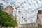 LONDON, ENGLAND - AUGUST 18, 2016: London Downtown with People and Construction Area. Shell Centre in Background with Cloudy Blue