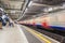 LONDON, ENGLAND - AUGUST 18, 2016: Westminster Underground Station in London, England. Blurry Train because of Long Exposure.