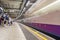 LONDON, ENGLAND - AUGUST 18, 2016: Westminster Underground Station in London, England. Blurry Train because of Long Exposure.