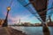 London, England - Beautiful sunset scene at Millennium Bridge with famous skyscraper