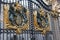 London, England. Buckingham Palace gates with Coats of Arms close up