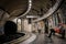 LONDON, ENGLAND, DECEMBER 10, 2018: People waiting for the train at the Waterloo tube station full with signs and advertisements