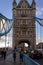 LONDON, ENGLAND, DECEMBER 10th, 2018: People crossing ower Bridge in London, the UK. English symbols. Seen from the