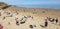 London, England, Folkestone, kent: June 1st 2019:Tourists on Sunny sands beach enjoying the beautiful sunshine and blue sky on the