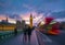 London, England - Iconic Red Double Decker Bus on the move on Westminster Bridge with Big Ben and Houses of Parliament